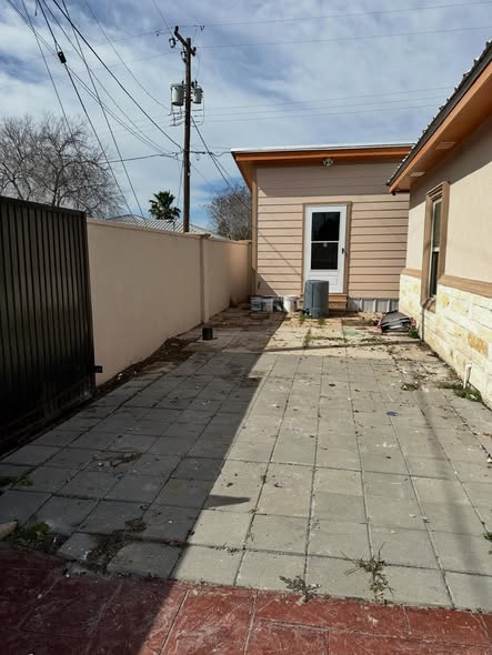 Same backyard patio completely cleared and clean after Super Trash Pros junk removal